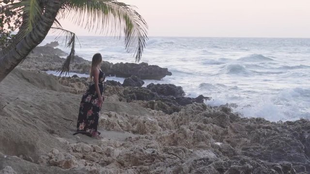 Slow Motion: An Exotic Woman Turns To Look at the Sea in Cabarete, Dominican Republic