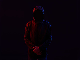 Dangerous hooded hacker. Internet, cyber crime, cyber attack, system breaking and malware concept....