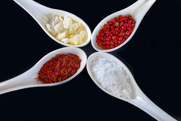 Seasonings  in spoons  . Isolated. Closeup