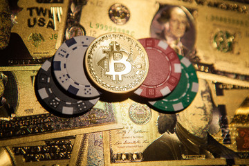 Colorful casino chips, dollars, bitcoins and red dice