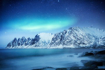 Natural phenomenon - aurora borealis on Lofoten islands in Norway, Scandinavia - the UNESCO world heritage spot, location - Senja island, Tromso on March