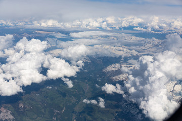 Naklejka premium Fluffy white clouds, a view from airplane window