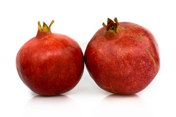 Pomegranate isolated on white background. Still-life picture taken in studio with soft-box.