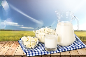 Glass of milk and bottle on  background