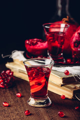 Shot glass of pomegranate tincture