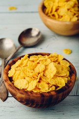 Rustic bowls of cornflakes with spoons
