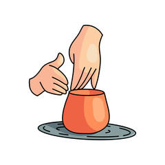 Hand pottery work on rotating wheel at home room