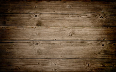 Naklejka na ściany i meble Warm brown wood surface with aged boards lined up. Wooden planks on a wall or floor with grain and texture. 
