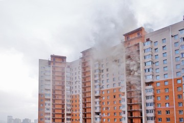 High-rise condominium or apartment burning. Fire in apartments of a large tenement-house. Fire on...