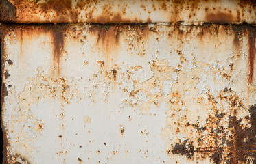 Rusty metal textured background with chipped white paint. Old rough rusted grungy surface