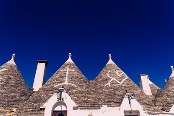 Roofs with symbols in the trulli, in the famous Italian city of Alberobello.