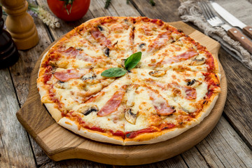 Pizza with ham and mushrooms