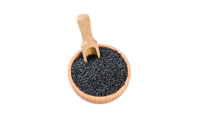 black lentils beluga in wooden bowl and scoop isolated on white background. nutrition. bio. natural food ingredient.