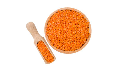 red lentils in wooden bowl and scoop isolated on white background. nutrition. bio. natural food ingredient.top view.