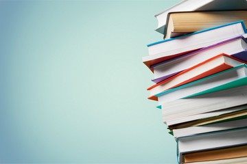 Books collection in pile on  background.