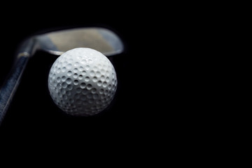 Golf ball on black background