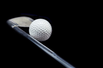 Golf ball on black background