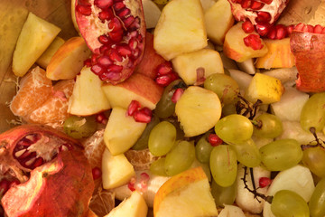 Cut fruits close up background. Mix fruits background. vibrant colored fruits.