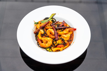 spicy black spaghetti with shrimps (tom yum kung)