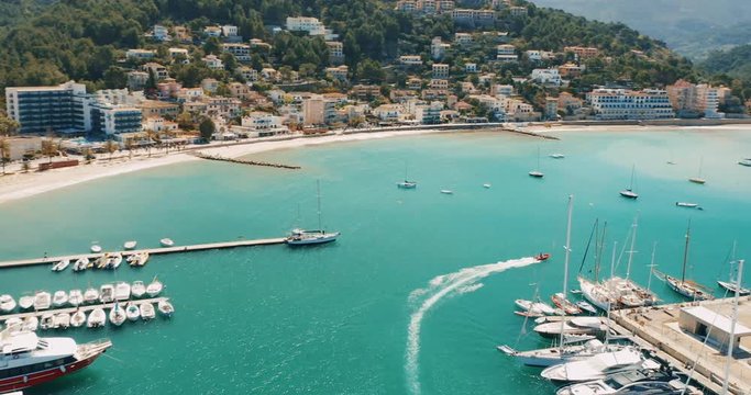 Port De Soler. Mallorca. Light Blue Beach Water And Swimming Boat. Spain. Europe.