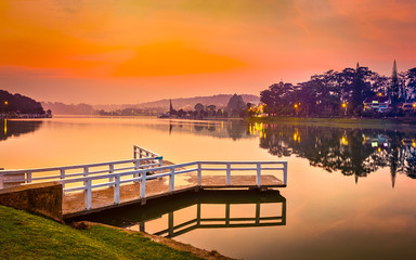 Naklejka na ściany i meble Sunrise over Xuan Huong Lake, Dalat, Vietnam. Panorama