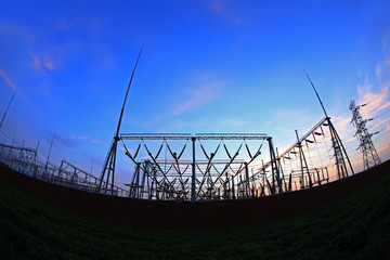 In the evening, the silhouette of high voltage towers