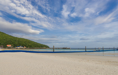 The beach and the sky on a quiet day, clouds floating, panorama