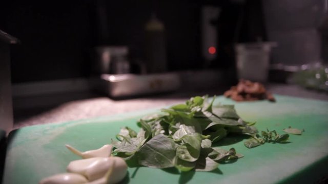 Footage Of ingredients On A Green Cutting Board SLIDE SHOT