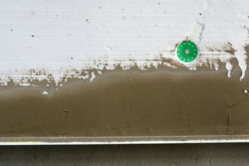 flat house wall insulating with white polystyrene fragment