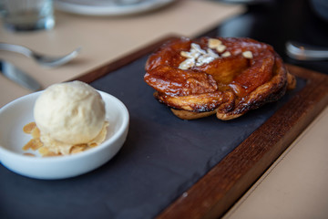 Apple tart tartin served with vanilla ice cream, sweetness and generous plate.