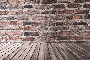 Dark room with brown stone brick wall and wood plank texture background.