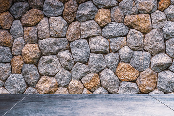 Dark room stone brick wall texture background.