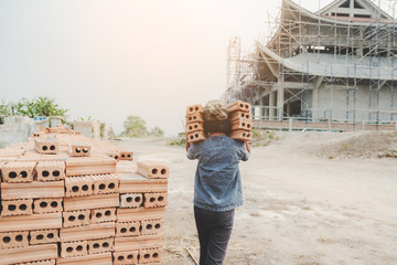 Child working in a brick factory. world day against child labour concept