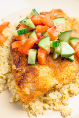 Prepared tilapia fish fillet served with salad. Selective focus. Shallow depth of field. 