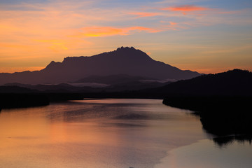 Amazing Beautiful Twilight Sunrise with Rays of light and Mount Kinabalu as background at Gayang, Tuaran, Sabah, Borneo