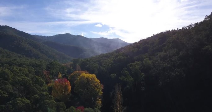 River flowing through a valley in mountain foothills (aerial view)