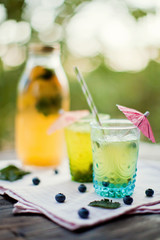 fresh lemonade with berries, citrus and mint