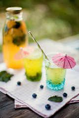 fresh lemonade with berries, citrus and mint