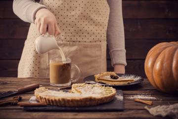 woman with  cup of coffee and pumpkin pie