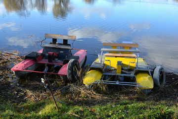 Two used Old pedal boat water bike on the lake