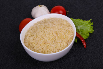 Raw uncooked rice in the bowl