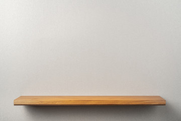 front view empty bookshelf and grey wall