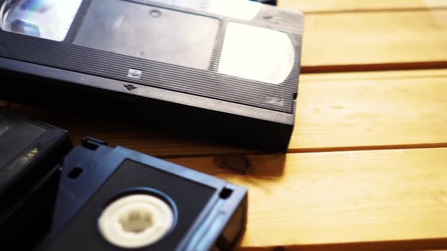 b roll stack of old VHS video tape cassette. vintage retro style. 80s and 90s concept 