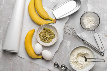 Ingredients for banana bread on grunge background