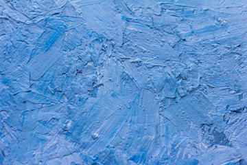 abstract background,wall covered with a thick layer of putty and painted blue