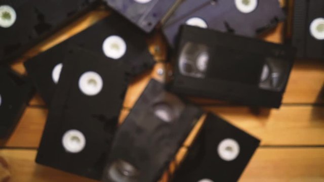 b roll stack of old VHS video tape cassette. vintage retro style. 80s and 90s concept 