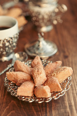 Turkish sweets with coffee on a wooden table