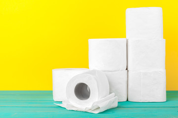 Toilet paper stacks  on bright yellow background