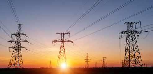 High voltage power lines in the winter. Thermal power plant. High-voltage transformer substation.