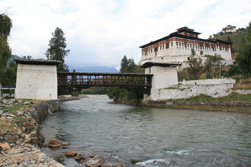 bridge and dzong in paro (bhutan)